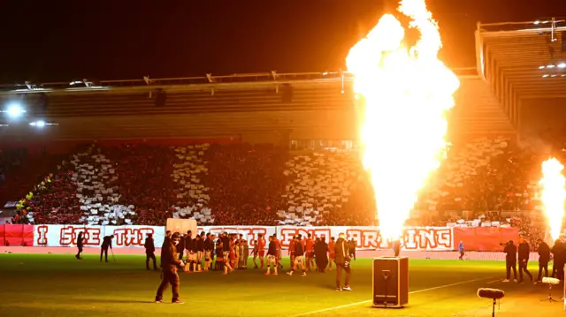 Middlesbrough and Sunderland players walk out at the Riverside with pyrotechnics going off