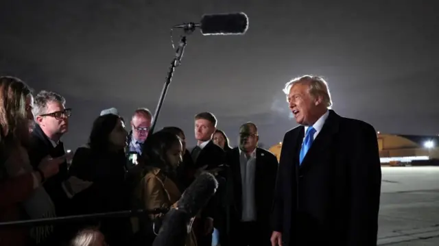 US President Donald Trump speaks to reporters after landing at Joint Base Andrews in Maryland