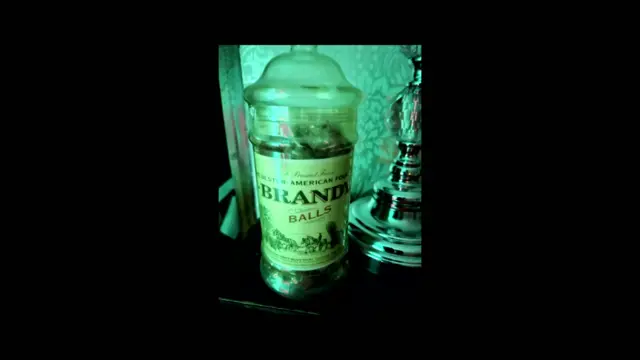 A picture of an old-fashioned jar of Brandy Balls from the Ulster American Folk Park