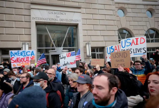 Protesters demonstrate outside of USAID