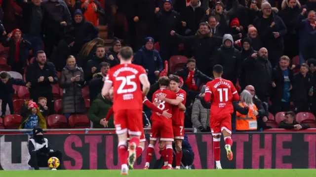 Middlesbrough players celebrate with Hayden Hackney