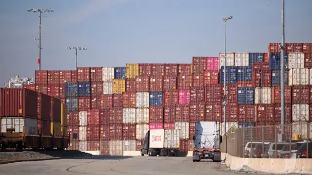 Shipping containers are stacked at the Port of Los Angeles