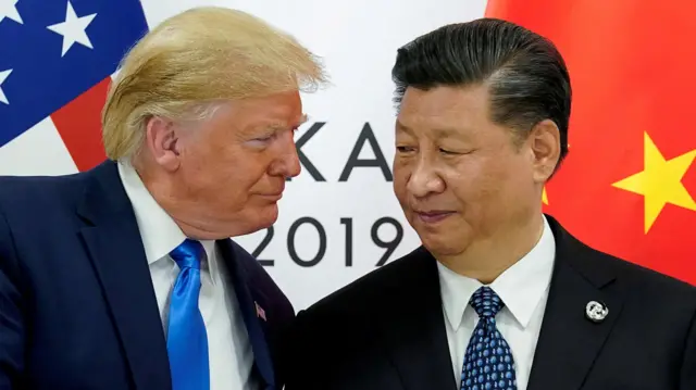 Donald Trump looks at Xi Jinping