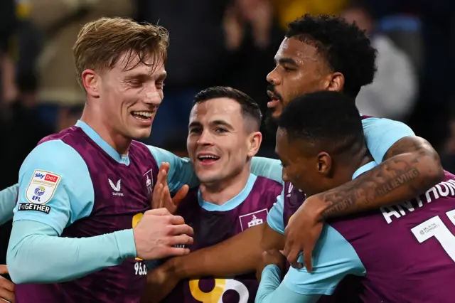 osh Cullen of Burnley celebrates with team-mates after Michal Helik of Oxford scored an own goal