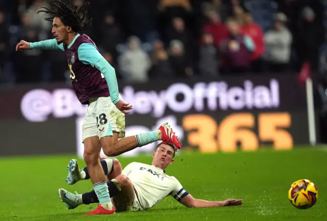 Burnley's Hannibal Mejbri (left) and Oxford United's Cameron Brannagan battle for the ball