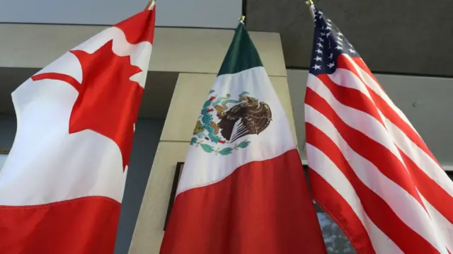 the flags of canada, mexico and the US.