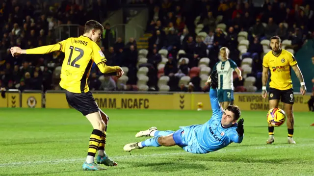 Joe Thomas of Newport County scores a goal