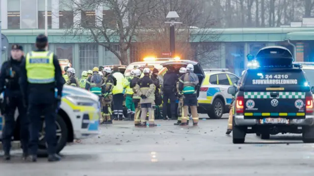 Members of the emergency services work at the scene of the Risbergska School in Orebro