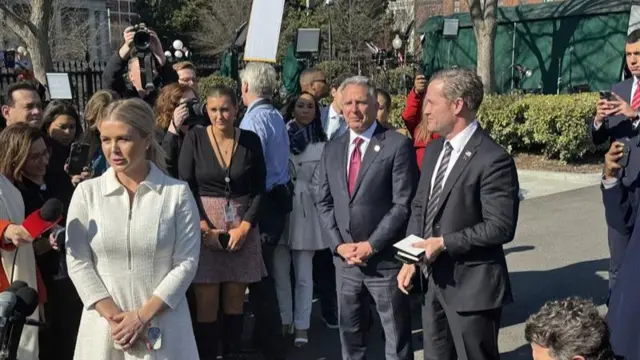 A group of reporters with National Security Adviser, Michael Waltz, along with Special Envoy to the Middle East Steve Witkoff in the centre along with Press Secretary Karoline Leavitt