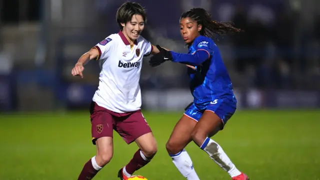 West Ham United's Riko Ueki (left) and Chelsea's Ashley Lawrence battle for the ball