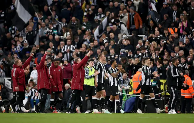 Newcastle players do a lap of honour at full time