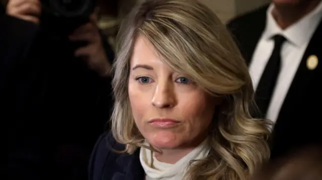 Canada's Minister of Foreign Affairs Melanie Joly looks on as she speaks to reporters in Ottawa