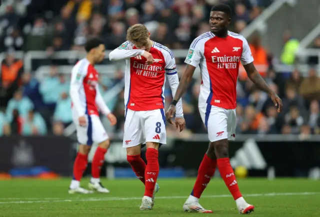 Odegaard wipes his face