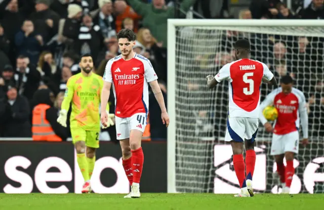 Arsenal players trudge back to kick off with heads bowed after conceding again