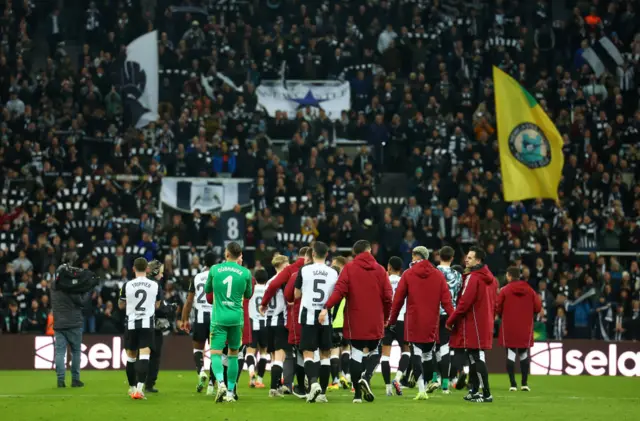 Newcastle players salute their fans at full time