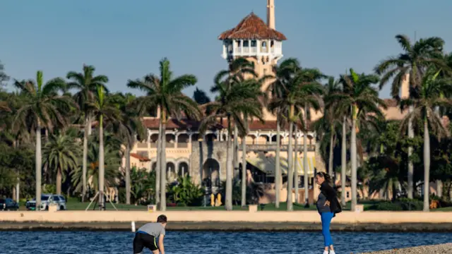People stand near Mar-a-Lago