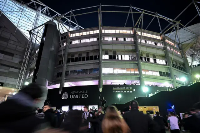 Newcastle fans make their way up the St James' Park approach