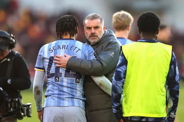Ange Postecoglou hugs Dane Scarlett