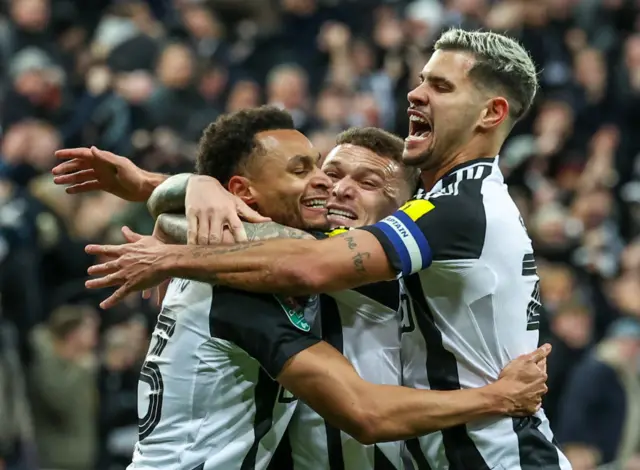 Newcastle players celebrate their opener v Arsenal