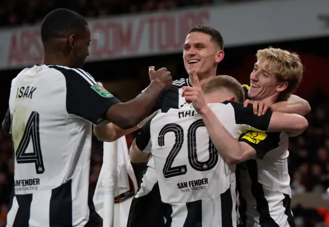 Newcastle celebrate scoring against Arsenal