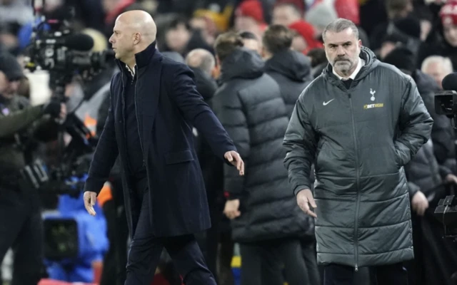 Tottenham Hotspur manager Ange Postecoglou (right) looks dejected after the final whistle