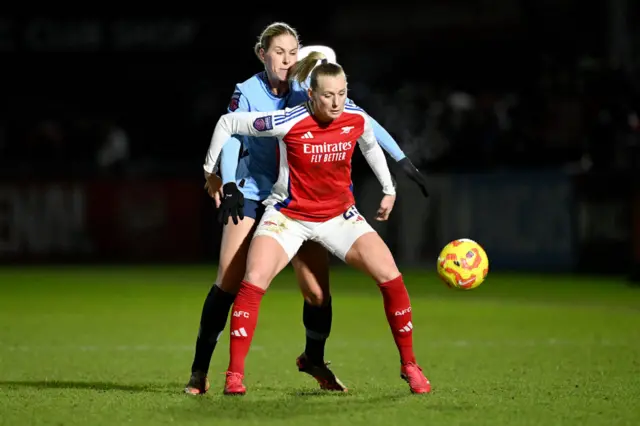 Stina Blackstenius of Arsenal looks to control the ball whilst under pressure from Rebecca Knaak