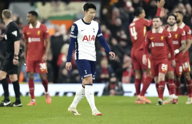 Tottenham Hotspur's Son Heung-Min (centre) looks dejected