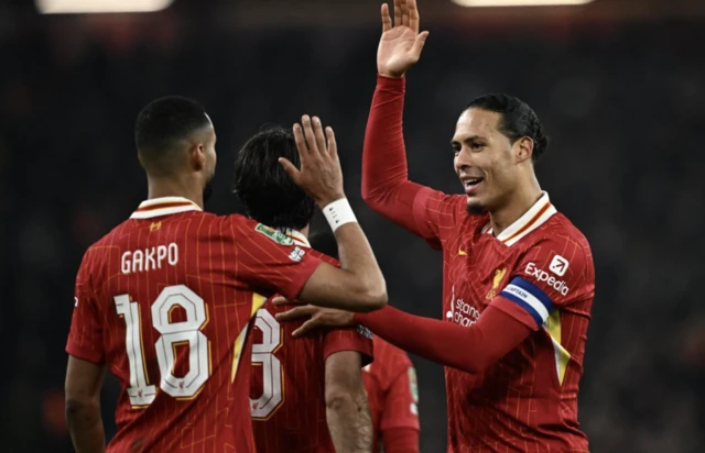 Liverpool's Dominik Szoboszlai celebrates scoring their third goal with Cody Gakpo and Virgil van Dijk