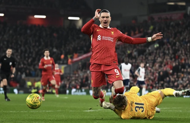 Tottenham Hotspur's Antonin Kinsky fouls Liverpool's Darwin Nunez to concede a penalty