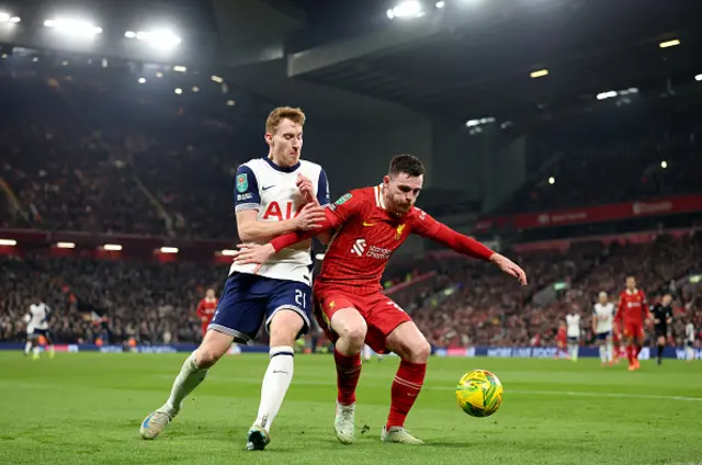 Dejan Kulusevski of Tottenham Hotspur and Andrew Robertson of Liverpool compete for the ball