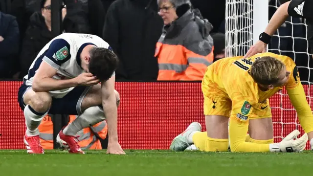 Tottenham Hotspur's Ben Davies and Antonin Kinsky after sustaining an injury