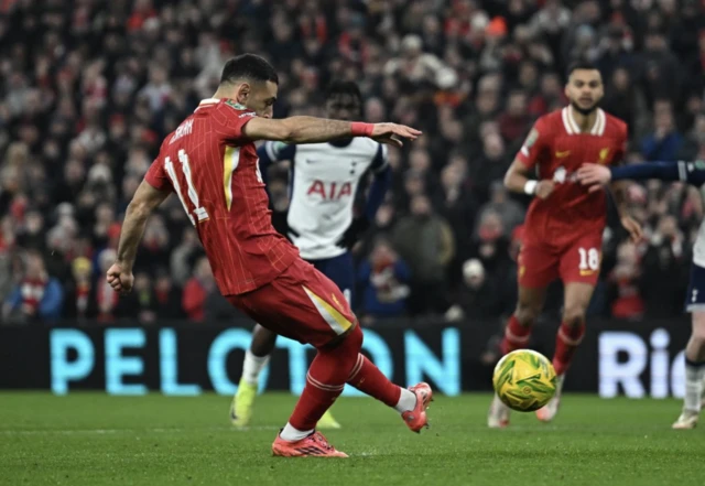 Liverpool's Mohamed Salah scores