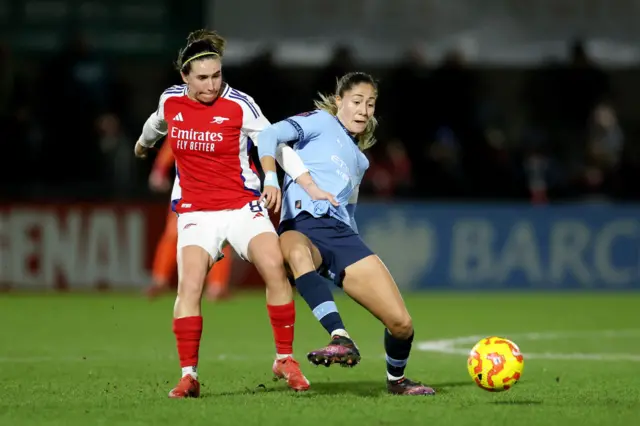 Laia Aleixandri of Manchester City is challenged by Mariona Caldentey