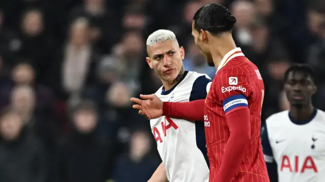 Tottenham Hotspur's Richarlison clashes with Liverpool's Virgil van Dijk