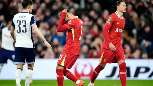 Liverpool's Mohamed Salah (centre) rues a missed chance