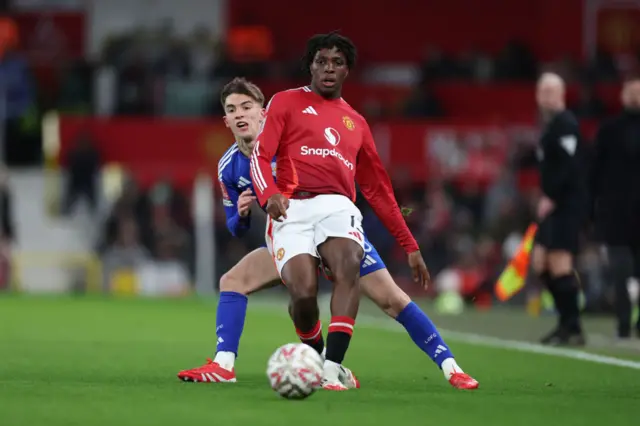 Luke Thomas of Leicester City in action with Patrick Dorgu.