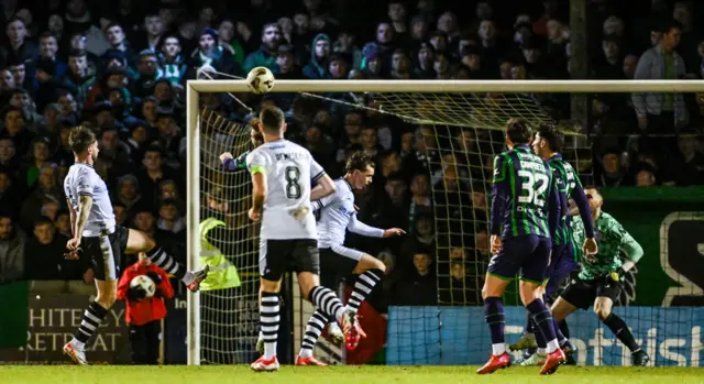 Ayr United's George Oakley (left) has a first-half header at goal