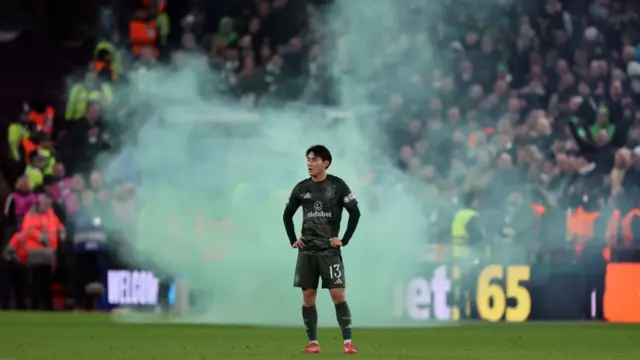 A green smoke bomb on the Villa Park pitch