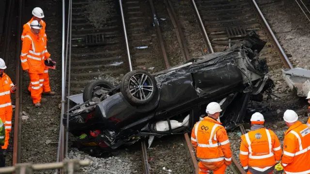 A close-up of the car which is badly damaged, especially at what appears to be the front