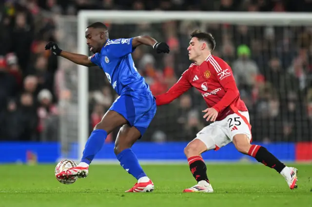 Boubakary Soumare of Leicester City is challenged by Manuel Ugarte.