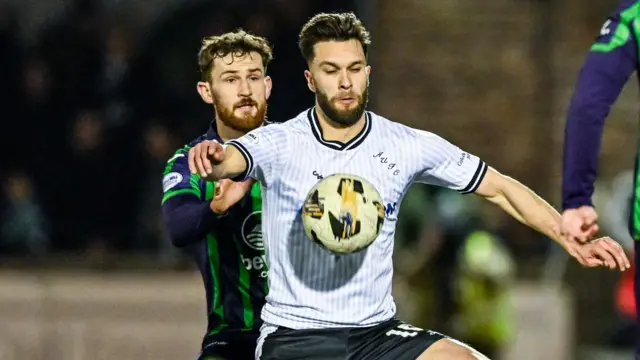 Jack Iredale battles for possession with George Oakley