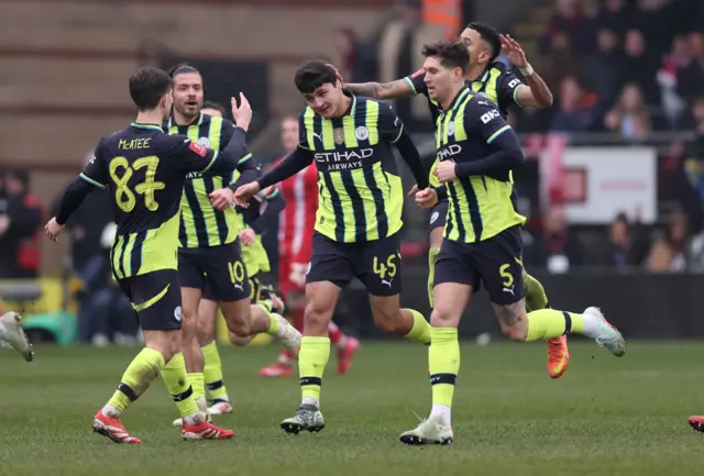 Manchester City's Abdukodir Khusanov celebrates scoring their first goa