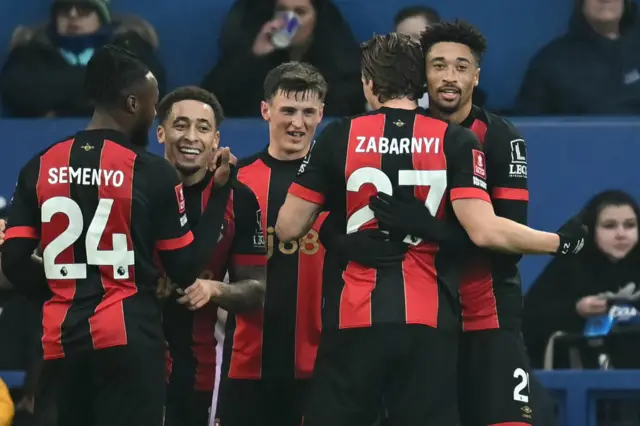 Daniel Jebbison celebrates with teammates after scoring