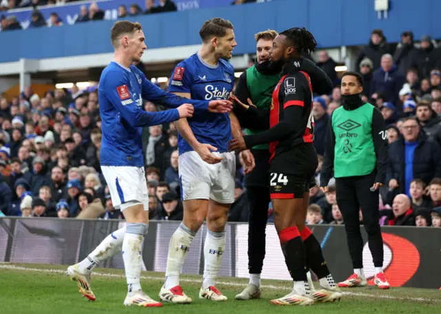 James Tarkowski of Everton clashes with Antoine Semenyo of AFC Bournemouth