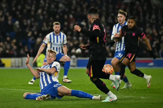 Brighton's Jan Paul van Hecke defends a Chelsea attack