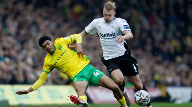 Norwich City's Lucien Mahovo is challenged by Derby County defender Sondre Langa