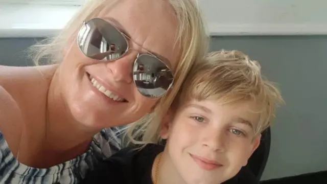 Hollie Dance and her son Archie smile for the camera