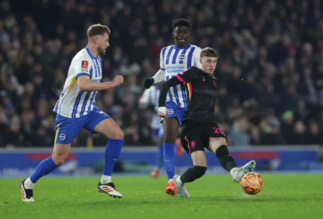 Cole Palmer of Chelsea passes the ball