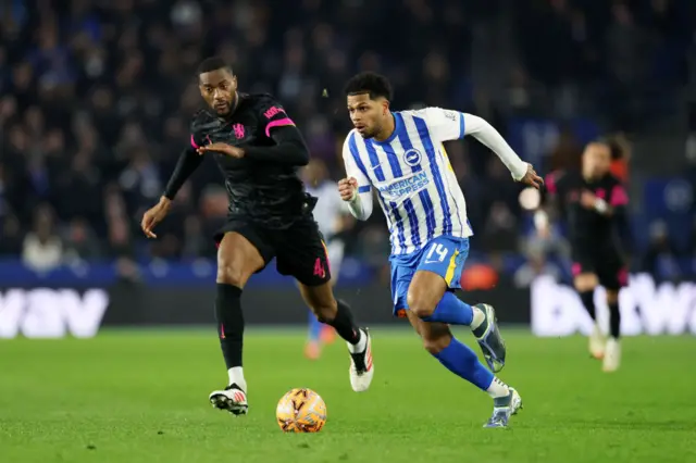 Georginio Rutter of Brighton & Hove Albion runs with the ball under pressure from Tosin Adarabioyo of Chelsea
