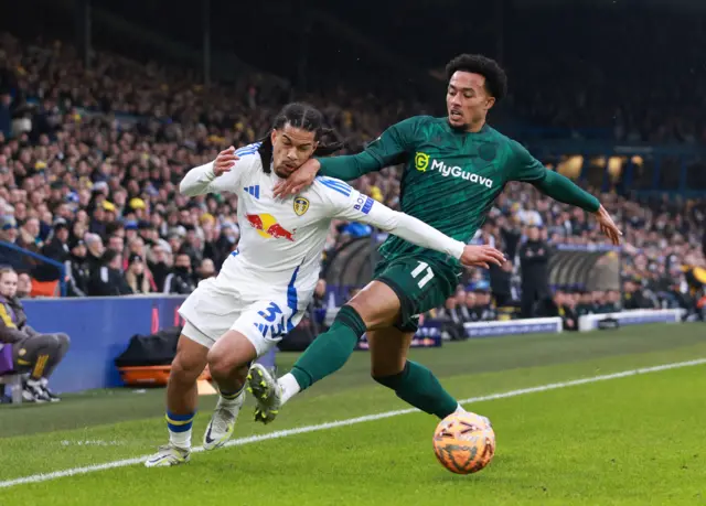 Leeds United's Isaac Schmidt in action with Millwall's Femi Azeez